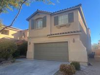 Two-story house with attached garage and landscaping at 6178 Pisan Ln, Las Vegas, NV 89148