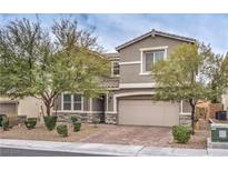 Charming two-story home featuring a neutral color scheme, manicured landscaping, and a two-car garage at 6403 Ava Ridge Ave, Las Vegas, NV 89141