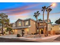 Two-story house with three-car garage and palm trees at 9225 Evergreen Canyon Dr, Las Vegas, NV 89134