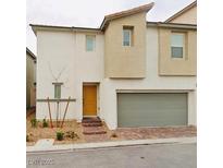 Modern two-story home with attached garage and landscaping at 6935 Magenta Moon St, North Las Vegas, NV 89086