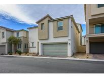 Charming two-story home features a neutral color palette and a convenient two-car garage at 6935 Magenta Moon St, North Las Vegas, NV 89086