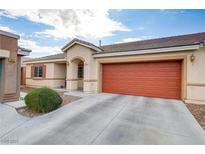 Single-story home with attached garage and landscaped front yard at 1017 Chestnut Bay Ave, North Las Vegas, NV 89031