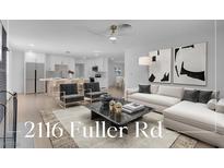 Open living room showcasing a stylish sectional sofa and modern coffee table at 2116 Fuller Rd, Las Vegas, NV 89108