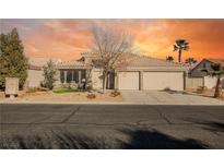 Beautiful single-story home with a three-car garage and desert landscaping at 5904 Negril Ave, Las Vegas, NV 89130