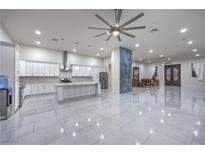 Spacious kitchen featuring modern white cabinets, large island, and high-end appliances at 1202 S Rancho Dr, Las Vegas, NV 89102