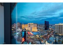 Stunning aerial view of Las Vegas skyline at dusk, showcasing city lights and iconic hotels at 3722 Las Vegas Blvd # 3102, Las Vegas, NV 89158