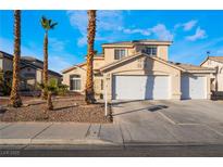 Two-story house with a two-car garage and desert landscaping at 4116 W Delhi Ave, North Las Vegas, NV 89032