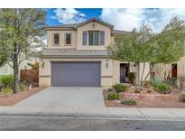 Two-story house with purple garage door and landscaped yard at 6504 Birdcall St, North Las Vegas, NV 89084