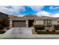 Single-story home with two-car garage and landscaping at 788 Flowing Meadow Dr, Henderson, NV 89014