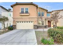 Two-story house with beige exterior, attached garage, and landscaping at 9609 Rolling Thunder Ave, Las Vegas, NV 89148