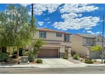 Two-story house with brown garage door and landscaped front yard at 2772 Drummossie Dr, Henderson, NV 89044