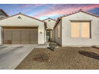 Charming single-story home with a well-maintained front yard and a two-car garage at 3740 Corte Bella Hills Ave, North Las Vegas, NV 89081