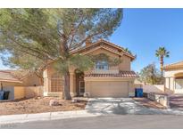 Charming two-story home with desert landscaping, a covered entry, and a two car garage at 5037 Monte Del Sol Ln, North Las Vegas, NV 89031