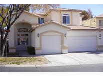 Charming stucco home featuring a three-car garage and well-maintained landscaping at 5524 Big Sky Ln, Las Vegas, NV 89149