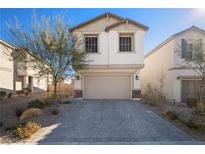 Charming two-story home featuring a paver driveway leading to a two-car garage, complemented by tasteful landscaping at 7044 Stockton Dunes St, North Las Vegas, NV 89084