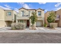 Two-story house with balcony, attached garage, and landscaping at 7660 Fabled Filigree St, Las Vegas, NV 89149