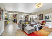 Open living area with sectional sofa, large TV, and modern decor at 8255 Las Vegas Blvd # 121, Las Vegas, NV 89123