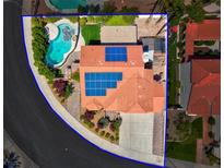 Aerial view of single story home with solar panels, pool, and landscaped yard at 2619 Grey Stone Rd, Henderson, NV 89074