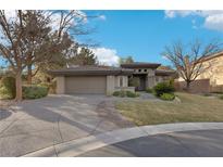 Single-story home with neutral exterior, attached garage, and landscaped yard at 3 Glendora Ct, Henderson, NV 89052