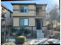 Two-story house with stone accents and a landscaped front yard at 3041 Savella Ave, Henderson, NV 89044