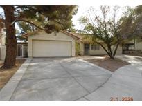 Single-story house with attached garage and mature landscaping at 384 Norlina Ct, Henderson, NV 89014