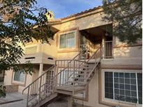 Tan two-story building with stairs leading to multiple entrances at 1600 N Torrey Pines Dr # 202, Las Vegas, NV 89108