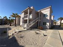 Two-story building exterior with stairs and landscaping at 1944 Las Palmas Ln # 175, Laughlin, NV 89029