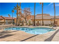 Community pool with surrounding patio and landscaping at 225 Big Horn Dr # 5, Boulder City, NV 89005