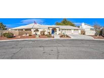 Beautiful single-story home with landscaped yard and three-car garage at 3540 E Burgundy Dr, Pahrump, NV 89048