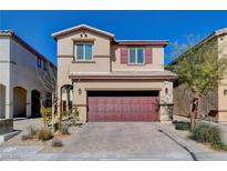 Charming two-story home with red brick driveway and garage, set against a clear blue sky at 3812 Seyfert Ave, North Las Vegas, NV 89084