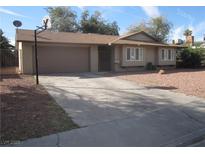 Ranch style home with attached garage and driveway at 3867 Jewel Ave, Las Vegas, NV 89121