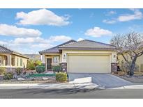 Single-story home with attached garage and landscaped front yard at 6075 Jutland Ave, Las Vegas, NV 89122