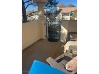 Private patio with gate access and seating area at 7961 Terrace Rock Way # 202, Las Vegas, NV 89128