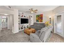 Spacious living room with built-in shelving and comfortable seating at 830 Carnegie St # 1821, Henderson, NV 89052