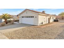 Single car garage with driveway and desert landscaping at 116 Crescent Bay St, Henderson, NV 89012