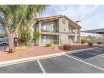 Two-story building exterior with parking and landscaping at 1575 W Warm Springs Rd # 1113, Henderson, NV 89014