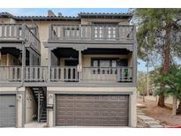 Spanish style condo with 2-car garage, private balcony, and nicely landscaped grounds at 2819 Calle Del Oro, Las Vegas, NV 89120