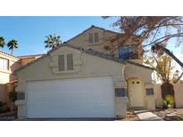 Two-story house with attached garage and landscaping at 346 Pinnacle Ct, Henderson, NV 89014