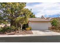 Single-story house with a two-car garage and mature landscaping at 448 Golden State St, Henderson, NV 89012