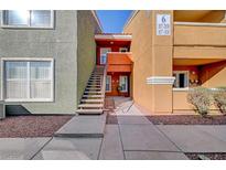 Exterior view of a multi-story condo with pedestrian walkway at 8101 W Flamingo Rd # 2037, Las Vegas, NV 89147