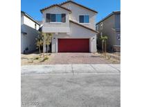 Two-story house with a red garage door at 9159 Oxford Blue Ave, Las Vegas, NV 89148