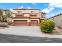 Two-story house with attached two-car garage, landscaping, and driveway at 167 Rising Mesa Ct, Henderson, NV 89012