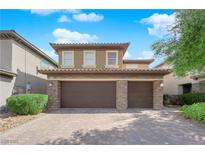 Charming two-story home with a three-car garage and desert landscaping at 2033 Old Field Ave, North Las Vegas, NV 89081