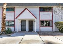 Front view of a two-story building with red accents at 225 Pecos Way, Las Vegas, NV 89121