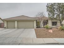 Charming single-story home featuring a three-car garage, low-maintenance landscaping, and a welcoming entrance at 6908 Bienville St, Las Vegas, NV 89131