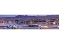 Luxury homes community overlooking lake and mountains at sunset at 144 Stone Mesa Ct, Henderson, NV 89011