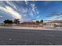 Single-story house with a large front yard and gated driveway at 3580 W Moberly Ave, Las Vegas, NV 89139