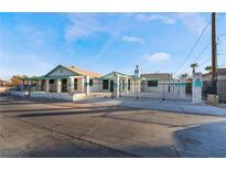 House exterior featuring a gated front yard and a large front porch at 3759 Glen Ave, Las Vegas, NV 89121