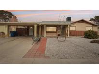 Ranch style home with carport, landscaped yard, and covered entryway at 3766 Millwood Ave, Las Vegas, NV 89121