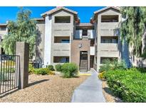 Two-story building exterior with walkway, landscaping, and parking area at 4200 S Valley View Blvd # 2081, Las Vegas, NV 89103